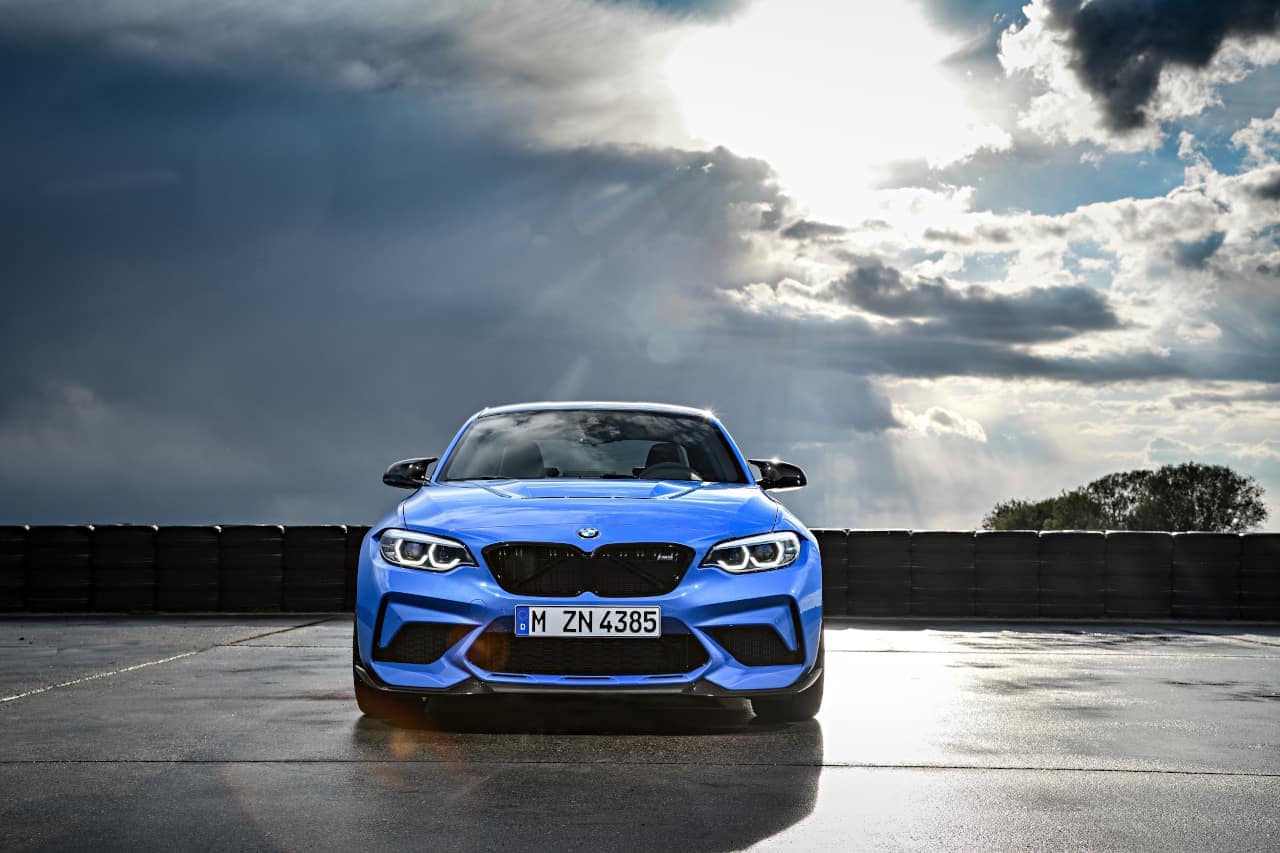 Artistic front image of blue BMW M2 CS