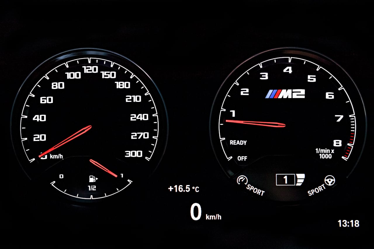 Shot of dashboard gauges including speedometer in BMW M2 Competition