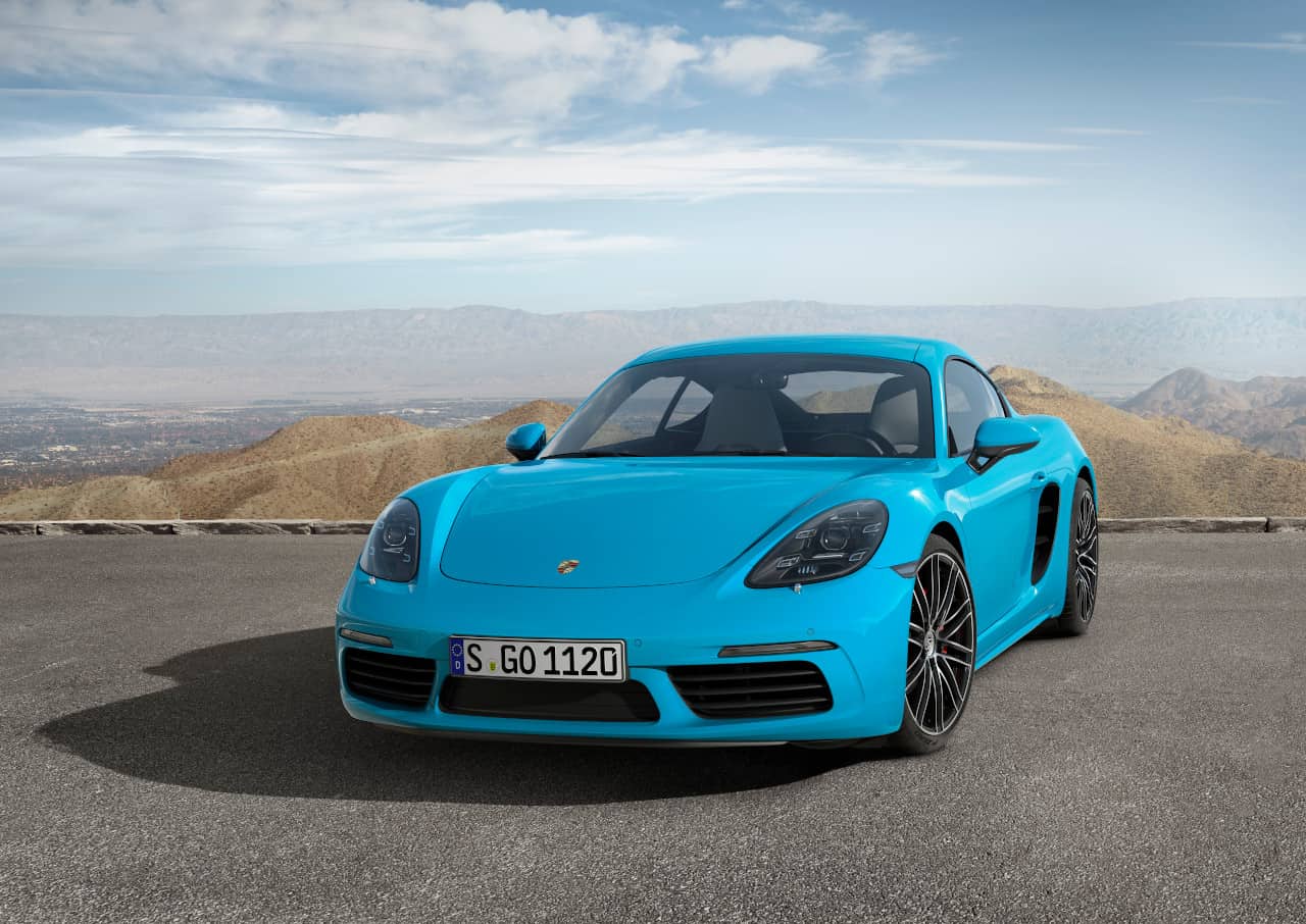 Front view image of turquoise Porsche 718 Cayman S