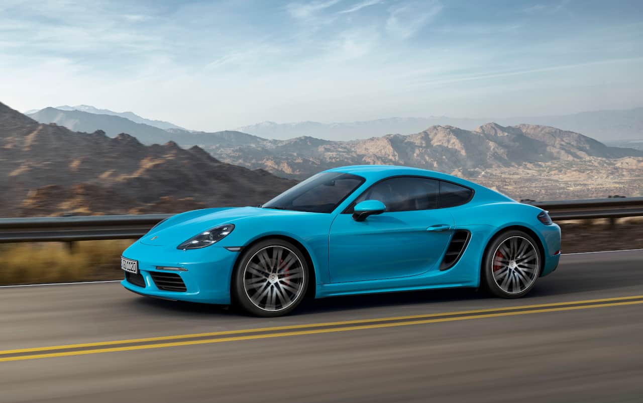 Sideview shot of turquoise Porsche 718 Cayman S
