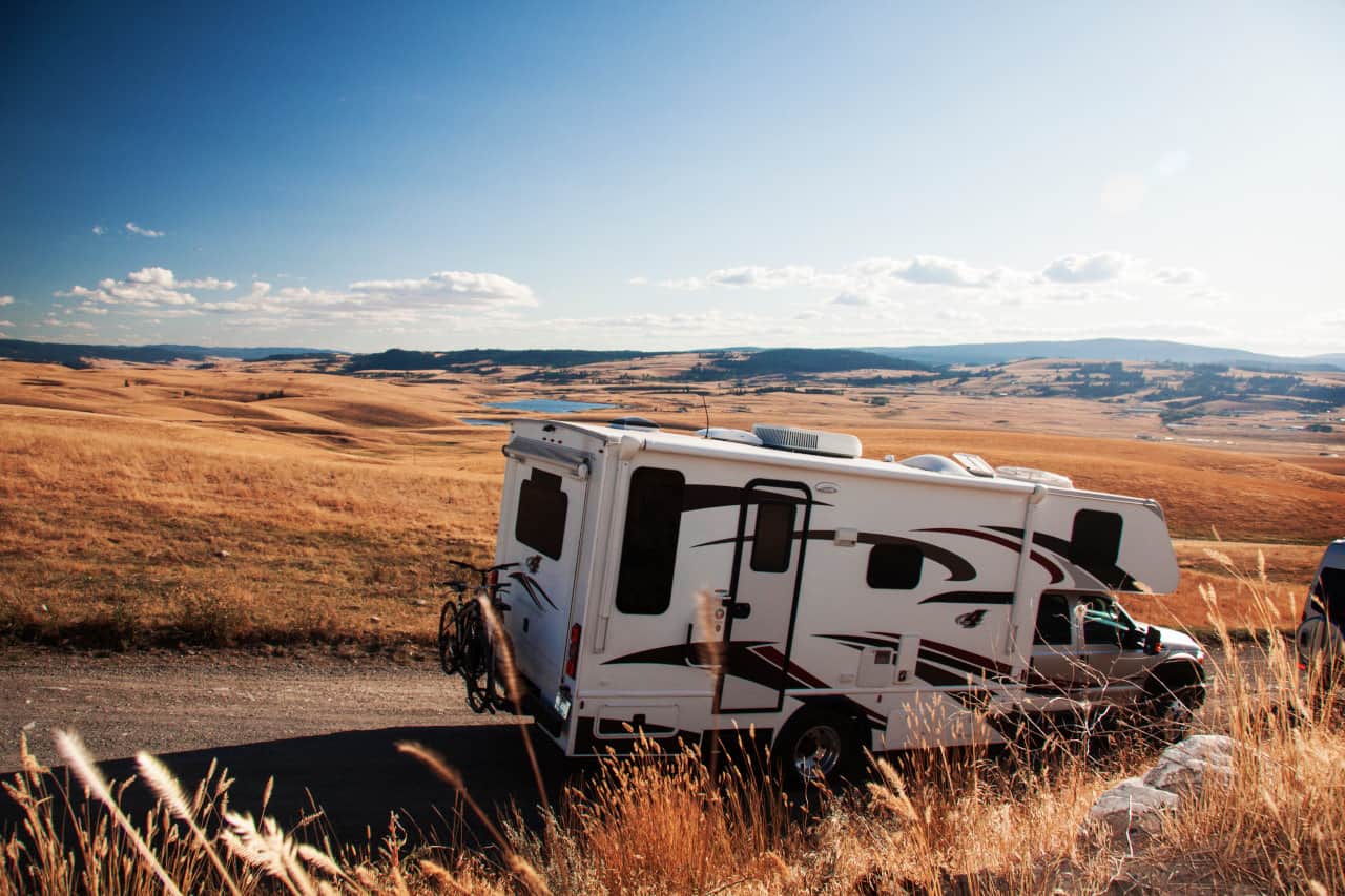 Image of an RV driving in the countryside