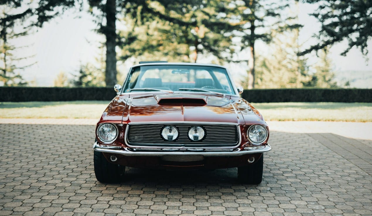 Ford Mustang parked in a driveway: easiest classic cars to restore