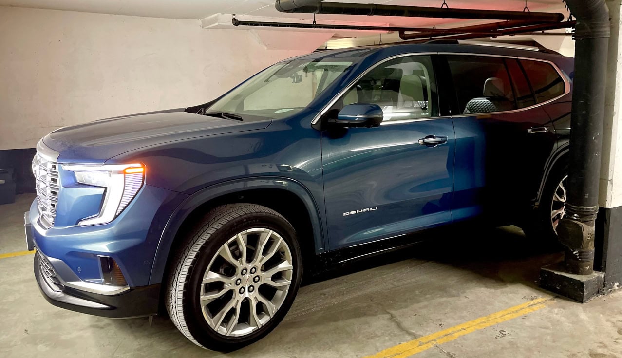 Blue 2025 GMC Acadia Denali, underground parking