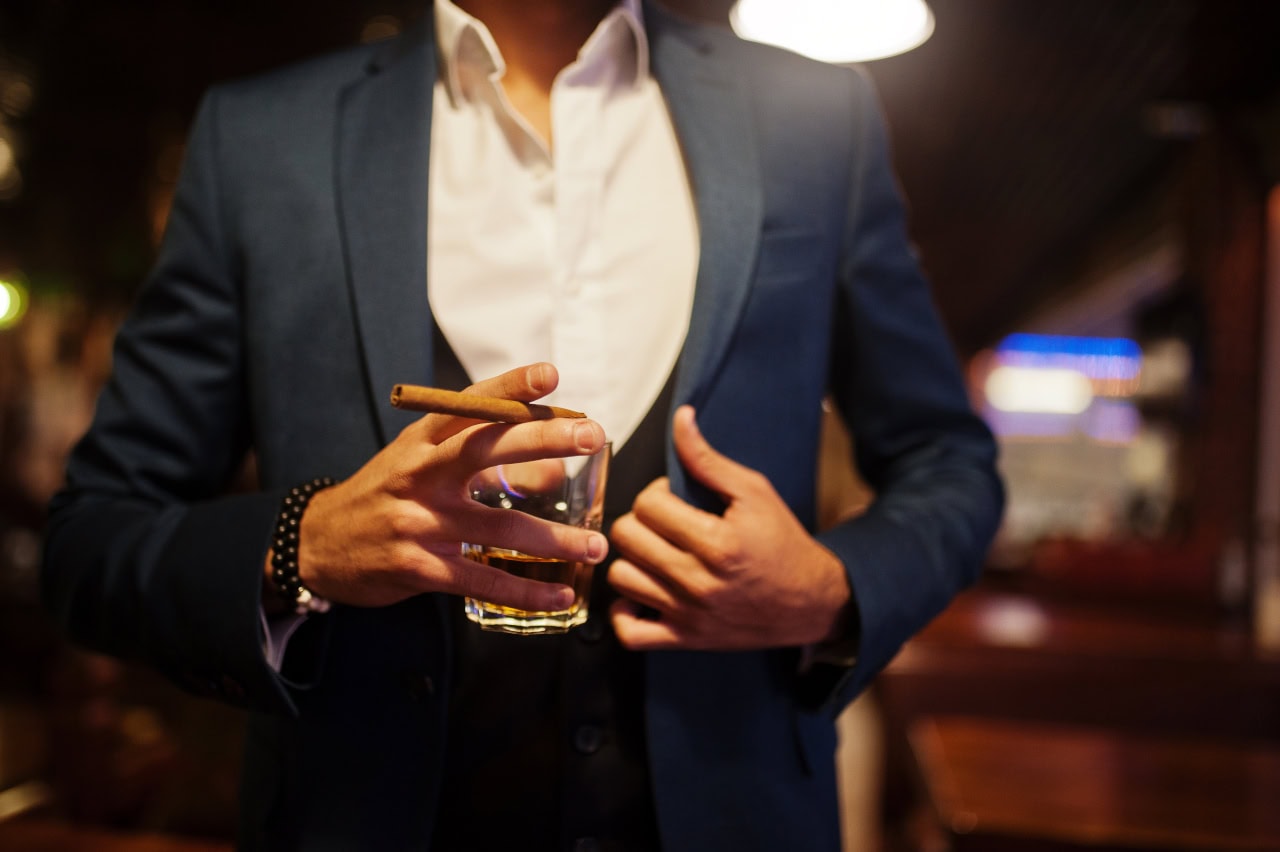 Close Up Hand Of Handsome Well-Dressed Arabian Man With Glass Of